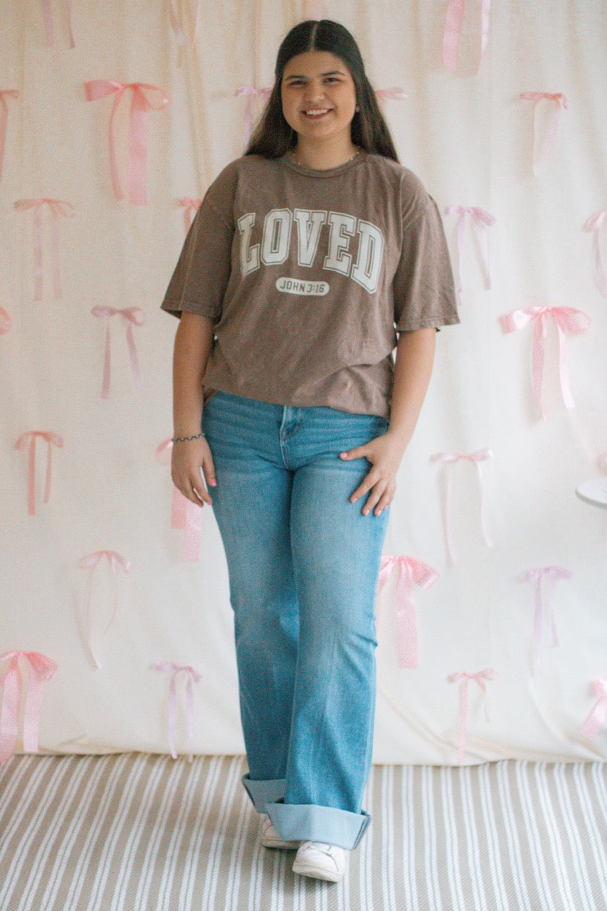 A brown acid mineral wash oversized t-shirt with the work Loved John 3:16 printed on the front