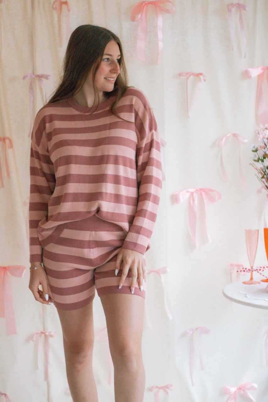 A pink and mauve striped soft knit sweater matching set with a long sleeve top and shorts