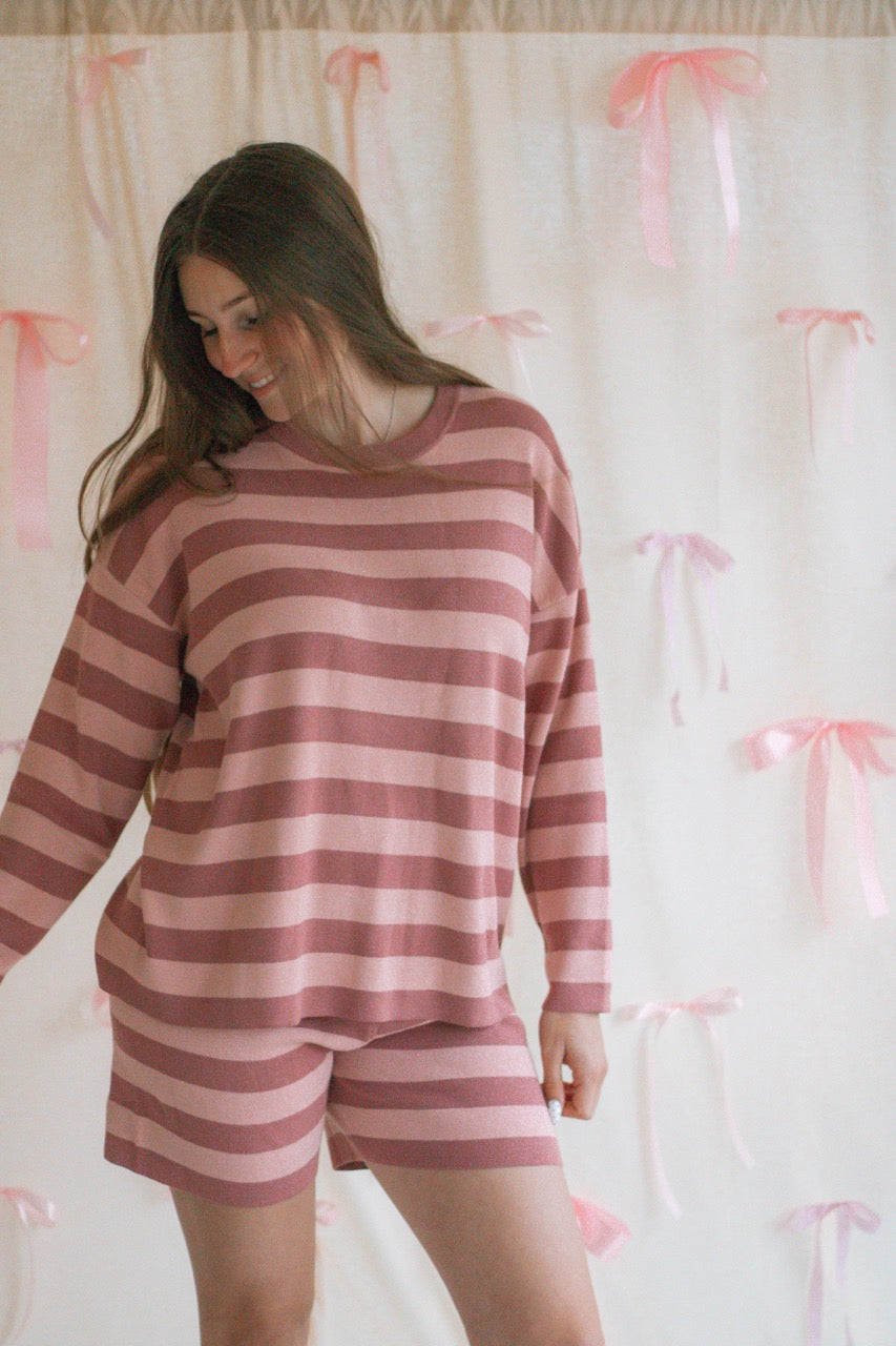 A pink and mauve striped soft knit sweater matching set with a long sleeve top and shorts