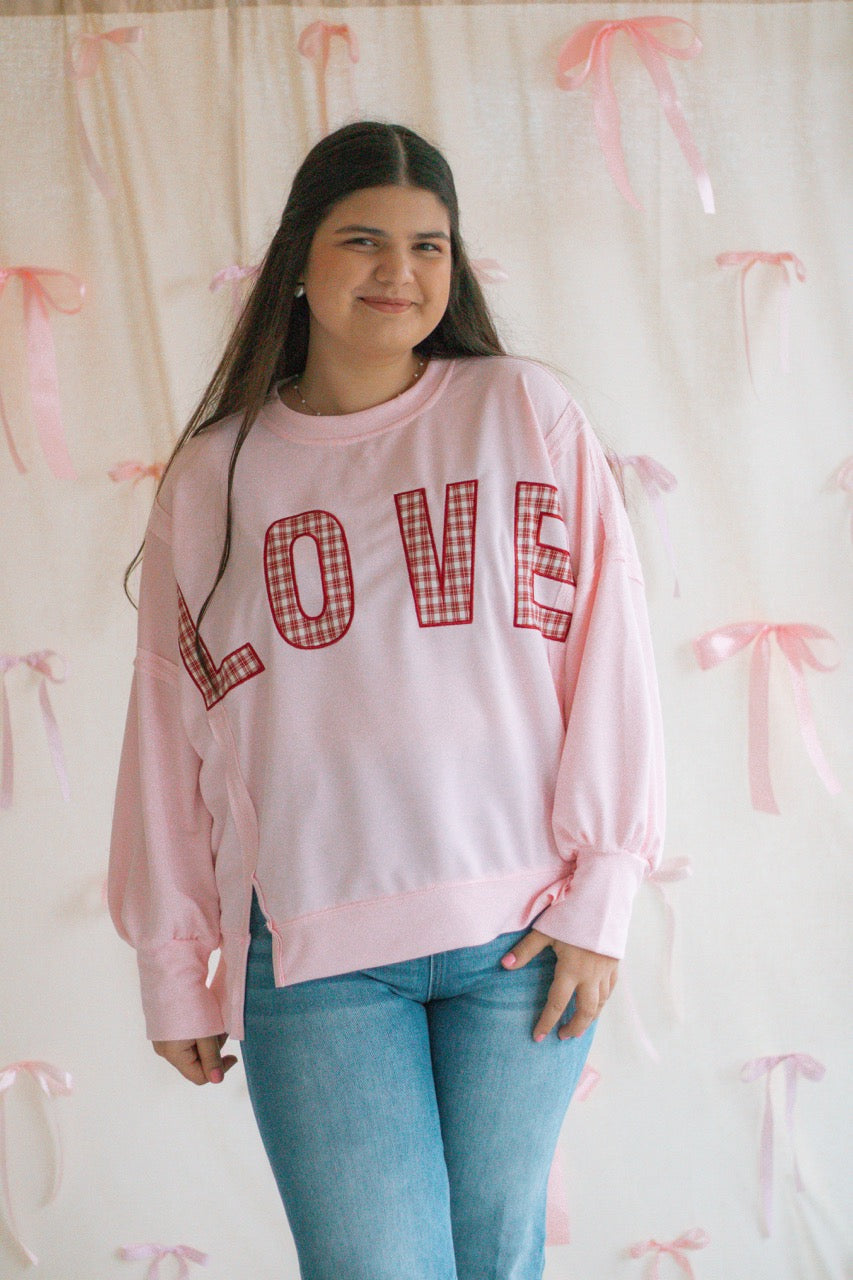 light bubblegum pink Terry cloth pullover with raw hem details, front slits, and red patchwork embroidered love
