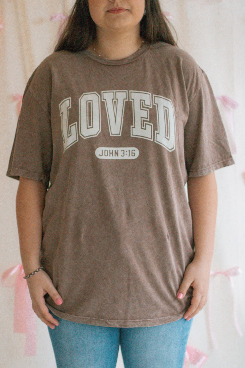 A brown acid mineral wash oversized t-shirt with the work Loved John 3:16 printed on the front