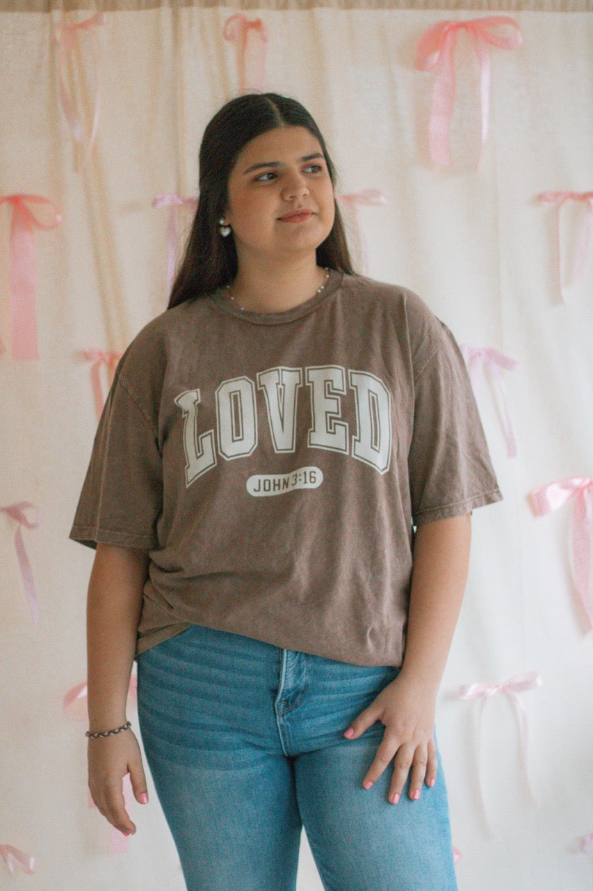 A brown acid mineral wash oversized t-shirt with the work Loved John 3:16 printed on the front