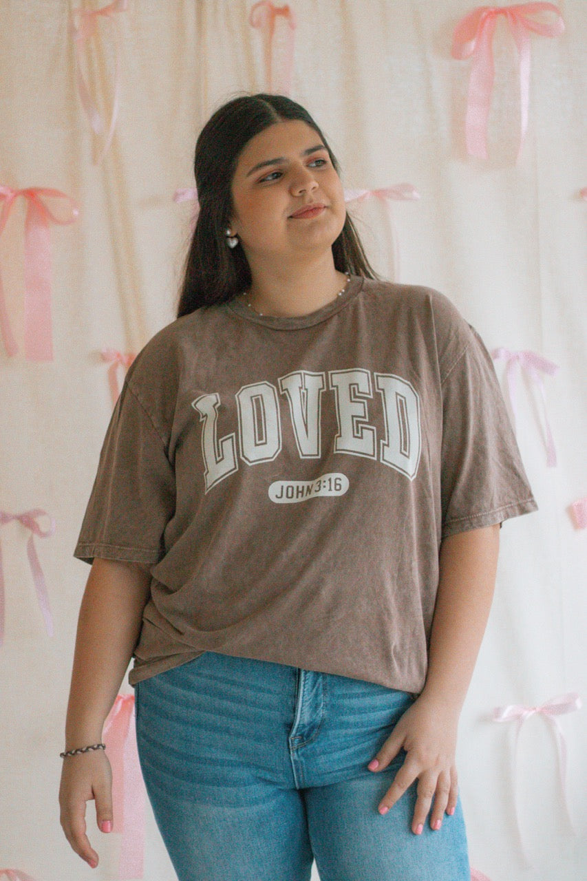 A brown acid mineral wash oversized t-shirt with the work Loved John 3:16 printed on the front