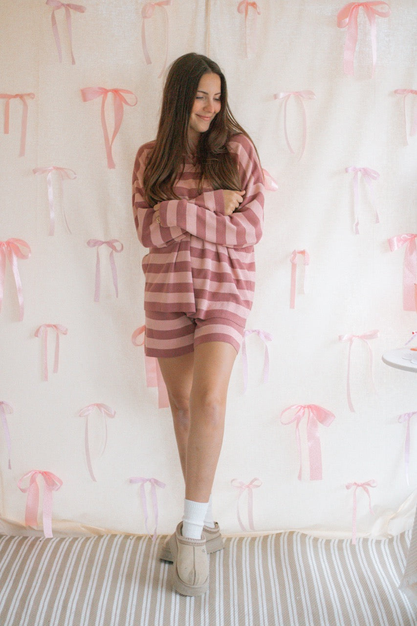 A pink and mauve striped soft knit sweater matching set with a long sleeve top and shorts