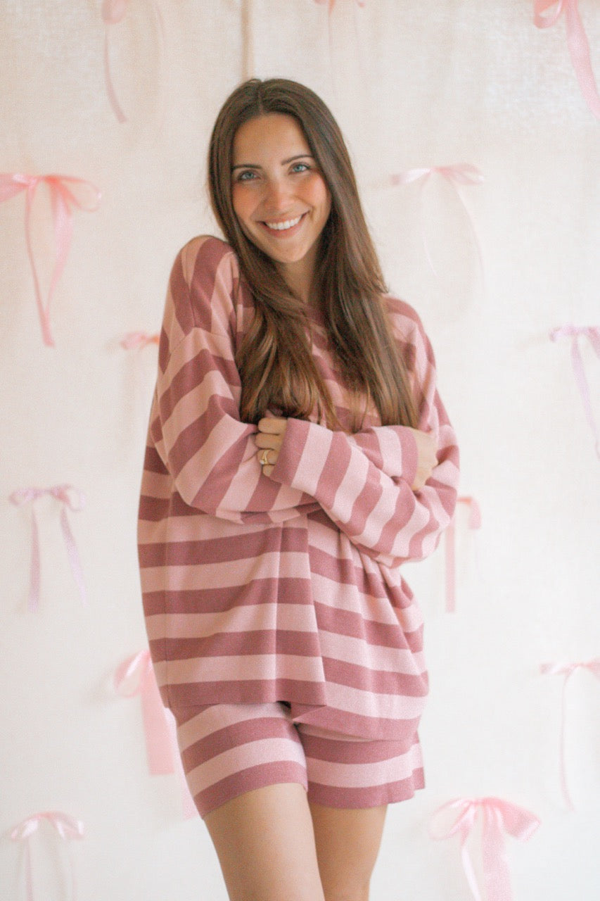 A pink and mauve striped soft knit sweater matching set with a long sleeve top and shorts