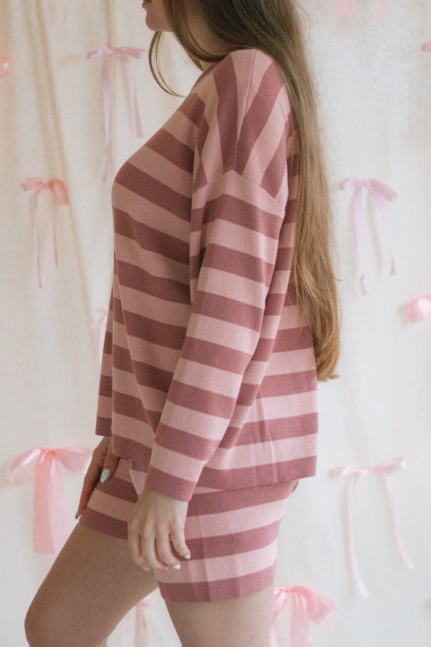 A pink and mauve striped soft knit sweater matching set with a long sleeve top and shorts