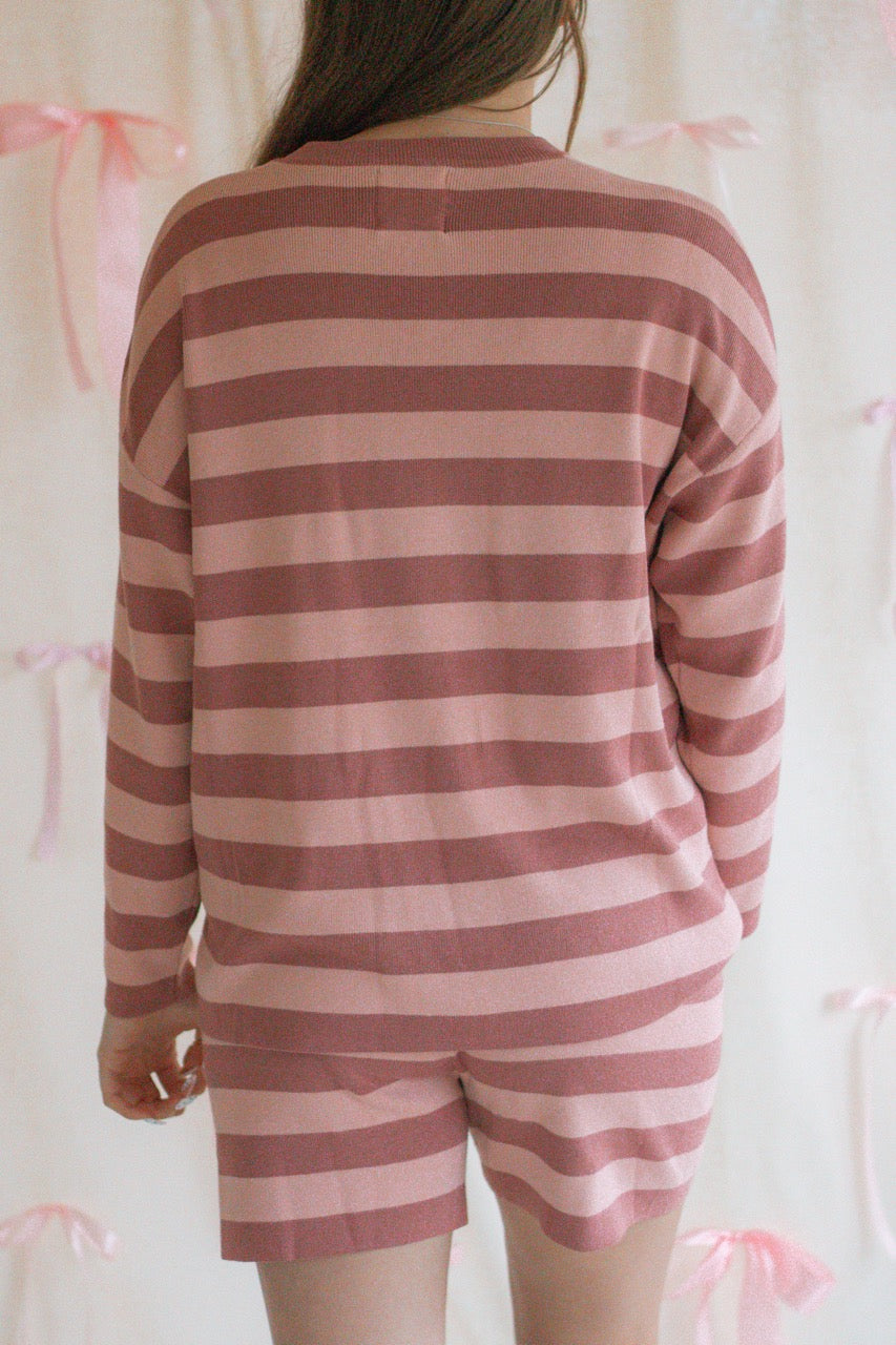 A pink and mauve striped soft knit sweater matching set with a long sleeve top and shorts