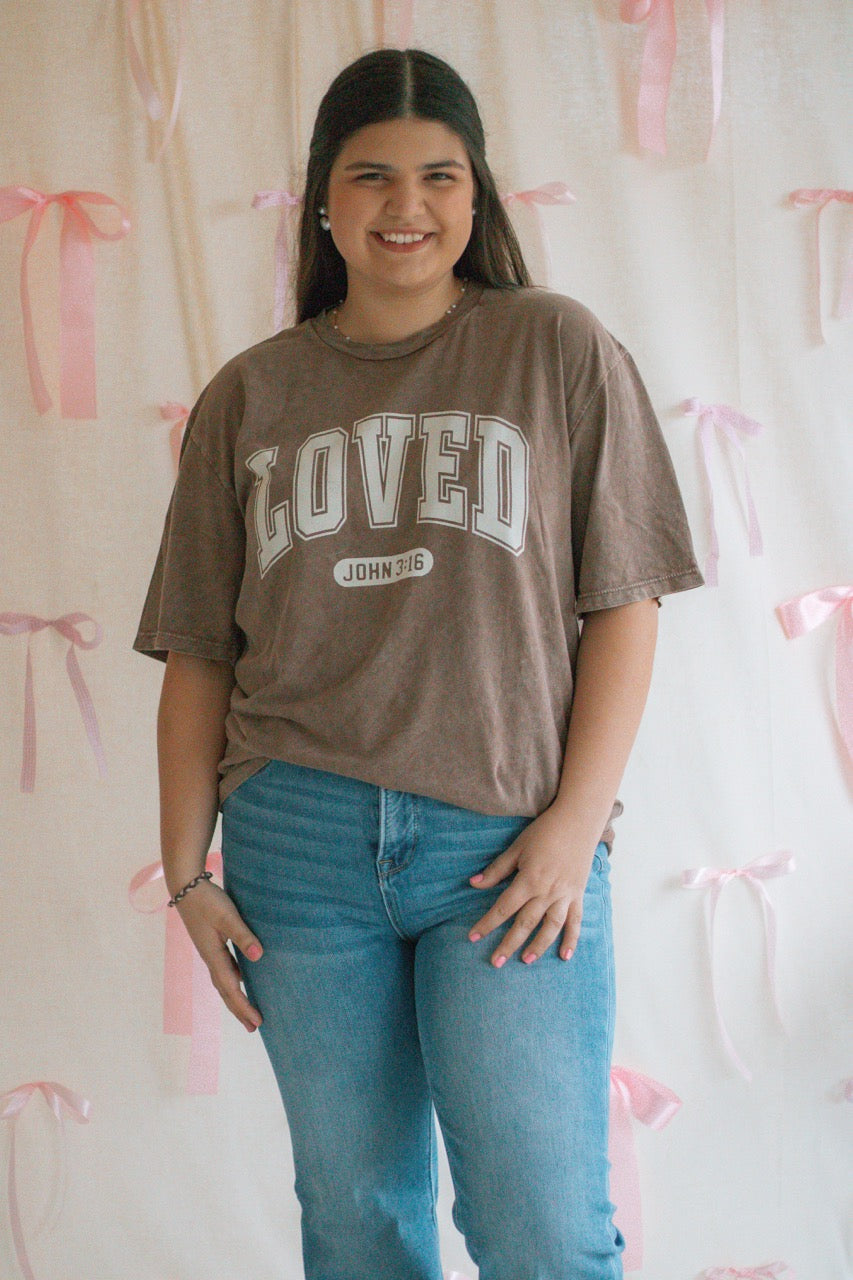 A brown acid mineral wash oversized t-shirt with the work Loved John 3:16 printed on the front
